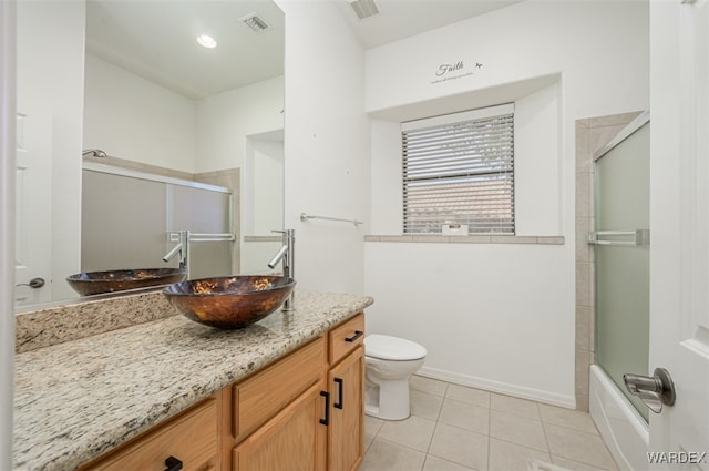 full bath featuring visible vents, vanity, toilet, and tile patterned floors