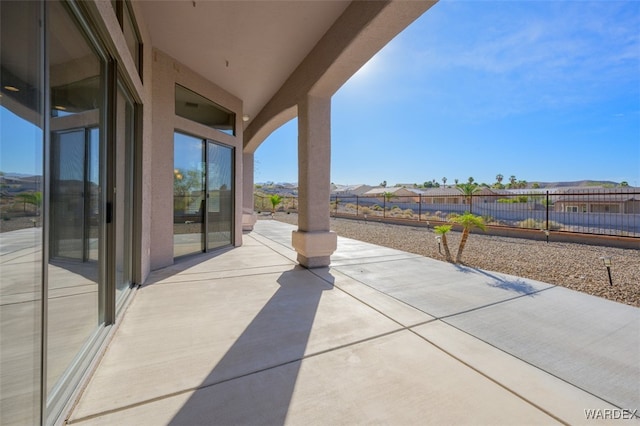 view of patio featuring fence