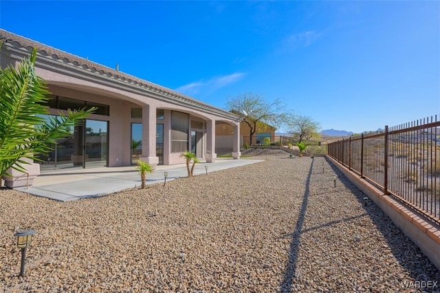 view of yard featuring a patio area and fence