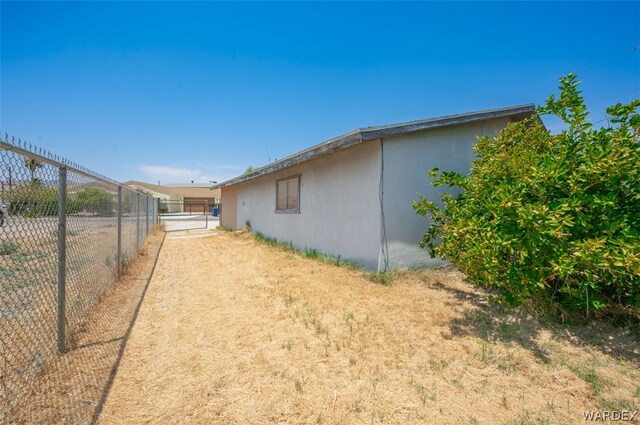 view of home's exterior featuring fence