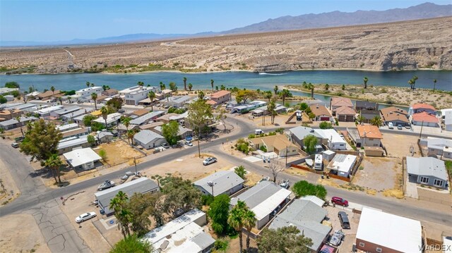 birds eye view of property featuring a residential view and a water and mountain view