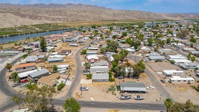 birds eye view of property featuring a residential view and a water and mountain view