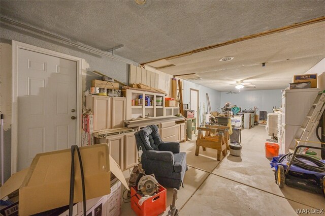 interior space featuring concrete floors and a textured ceiling