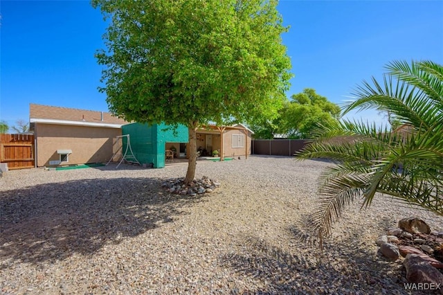 4804 S Baronsgate Way, Fort Mohave, AZ 86426 - view of yard with a fenced backyard and an outdoor structure