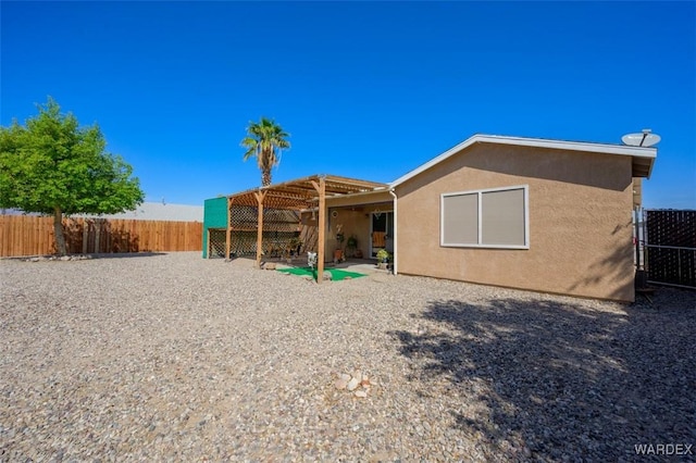 4804 S Baronsgate Way, Fort Mohave, AZ 86426 - rear view of property with fence and stucco siding