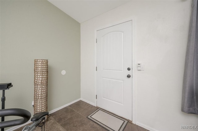 4804 S Baronsgate Way, Fort Mohave, AZ 86426 - entryway featuring dark tile patterned flooring, baseboards, and vaulted ceiling