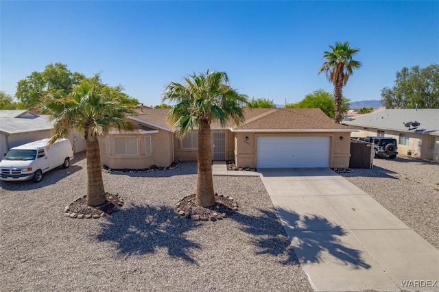 4804 S Baronsgate Way, Fort Mohave, AZ 86426 - ranch-style home featuring driveway, stucco siding, and an attached garage