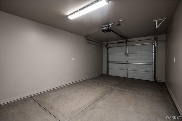 garage featuring baseboards and a garage door opener