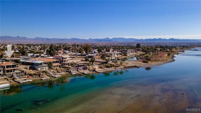 drone / aerial view featuring a residential view and a water and mountain view