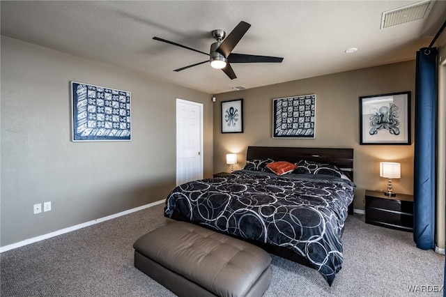 carpeted bedroom featuring a ceiling fan, visible vents, and baseboards