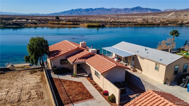 bird's eye view featuring a water and mountain view