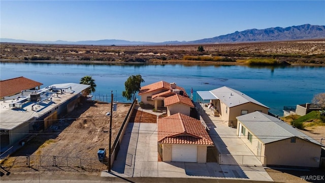 exterior space featuring a water and mountain view