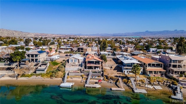 bird's eye view with a residential view and a water and mountain view