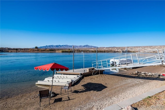 dock area featuring a water and mountain view