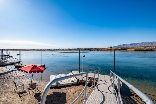 dock area with a water and mountain view