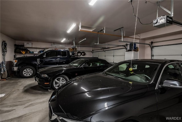 parking garage featuring a garage door opener