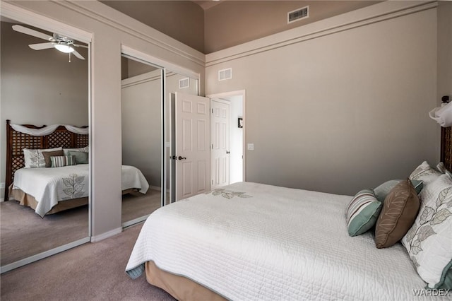 carpeted bedroom featuring visible vents