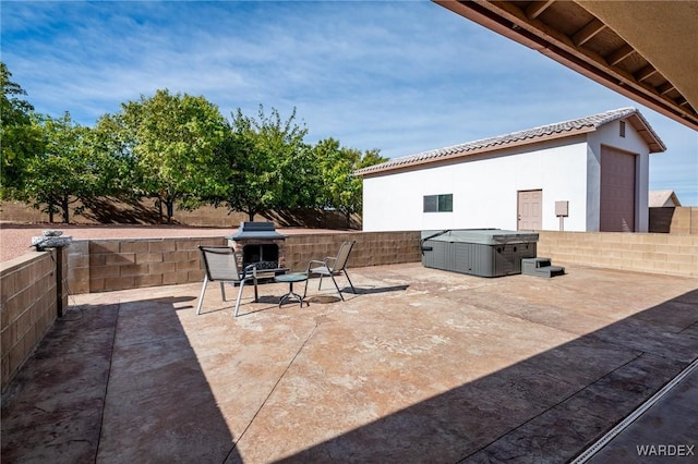 view of patio featuring an outdoor brick fireplace and fence