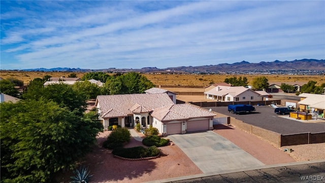 birds eye view of property with a mountain view