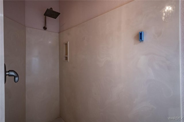 bathroom with tiled shower