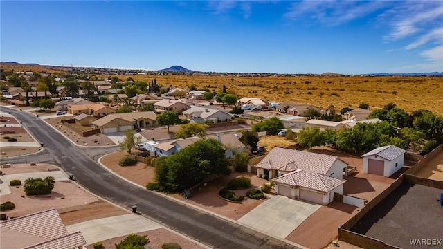 drone / aerial view featuring a residential view and a mountain view