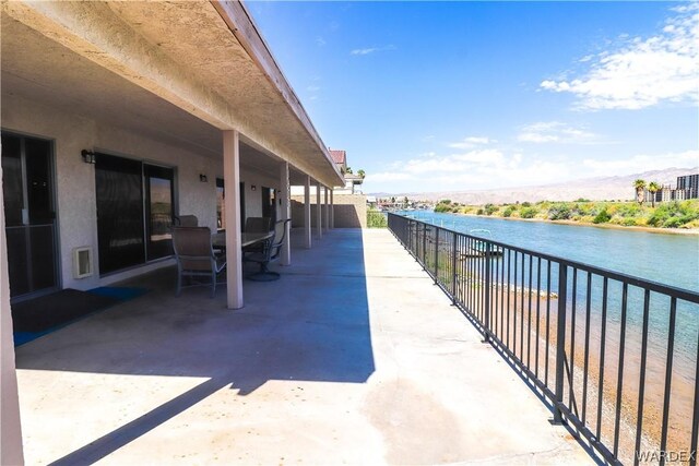 view of patio / terrace with a water view