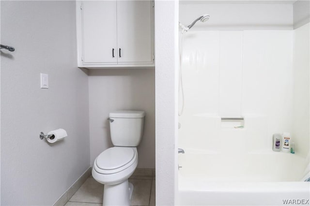 full bathroom featuring bathtub / shower combination, tile patterned flooring, toilet, and baseboards