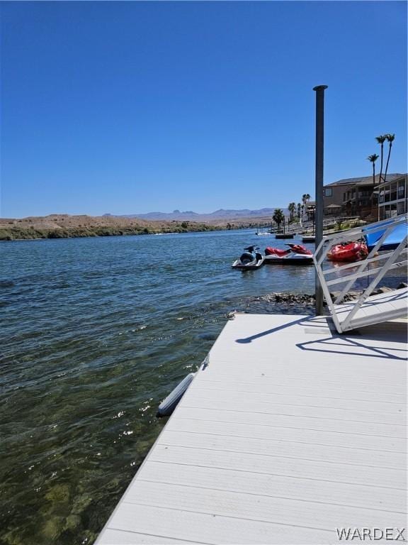 dock area with a water and mountain view