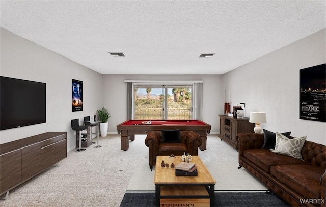 recreation room featuring light carpet, billiards, visible vents, and a textured ceiling