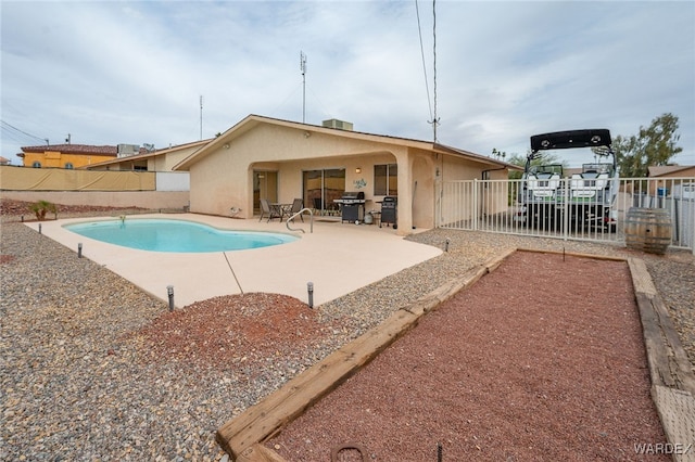 89 Keywester Dr, Lake Havasu, AZ 86403 - view of pool with a patio area, area for grilling, a fenced in pool, and a fenced backyard