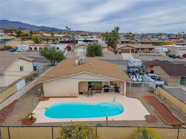 89 Keywester Dr, Lake Havasu, AZ 86403 - view of pool featuring a patio, a fenced backyard, a mountain view, a residential view, and a fenced in pool