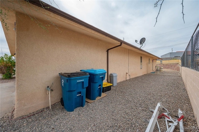 89 Keywester Dr, Lake Havasu, AZ 86403 - view of home's exterior featuring a gate, stucco siding, and fence