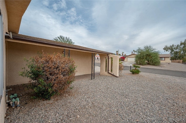 89 Keywester Dr, Lake Havasu, AZ 86403 - back of property featuring an outbuilding and stucco siding