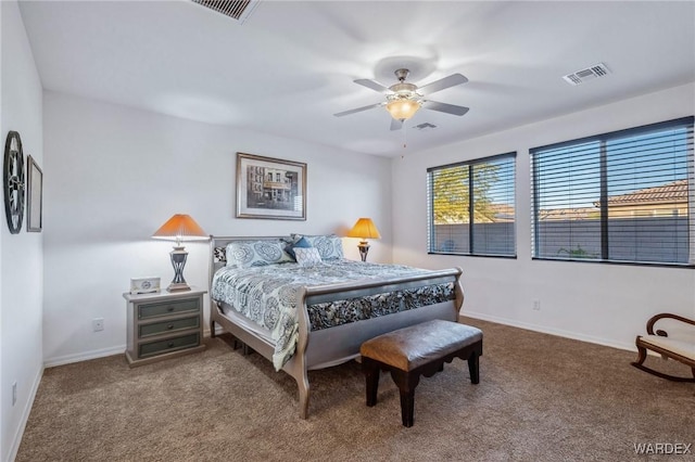 carpeted bedroom featuring visible vents, ceiling fan, and baseboards