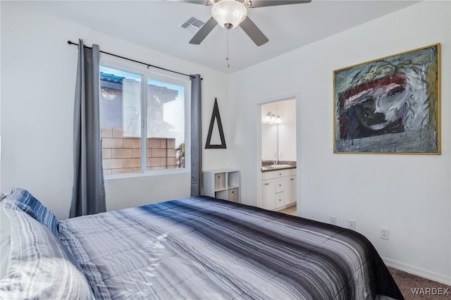 bedroom with ceiling fan, connected bathroom, visible vents, baseboards, and carpet