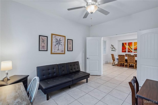 living room with light tile patterned floors and ceiling fan