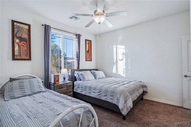 bedroom featuring visible vents, dark carpet, baseboards, and ceiling fan