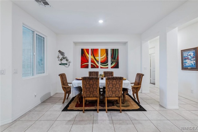 dining room featuring visible vents, baseboards, and light tile patterned flooring