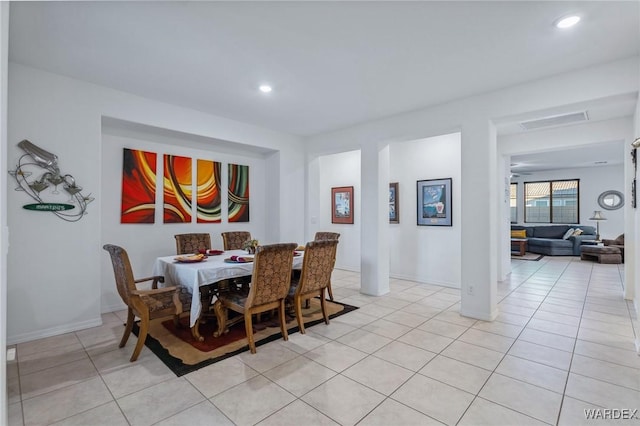 dining room with baseboards, light tile patterned flooring, visible vents, and recessed lighting