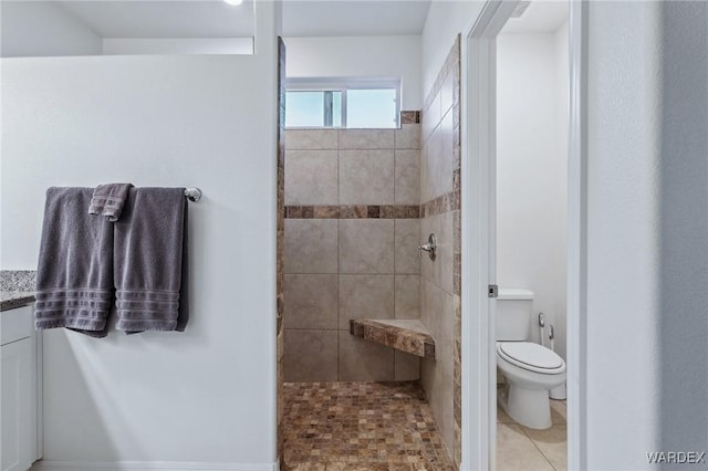 full bath featuring toilet, a walk in shower, and tile patterned floors