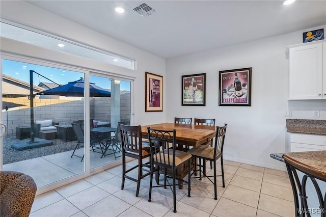 dining area with baseboards, plenty of natural light, visible vents, and recessed lighting