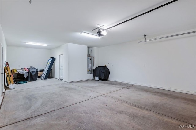 garage featuring water heater and a garage door opener