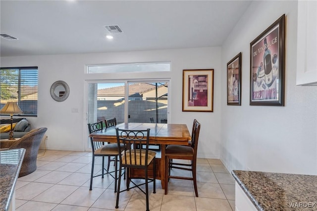 dining room with light tile patterned floors and visible vents