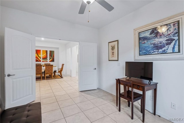 interior space featuring light tile patterned floors and a ceiling fan