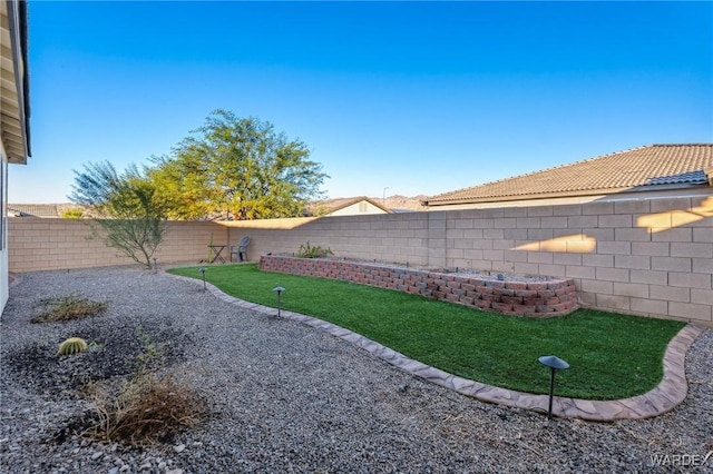 view of yard with a fenced backyard