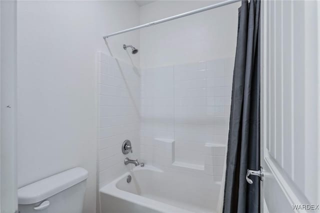 full bathroom featuring toilet and shower / bath combination with curtain