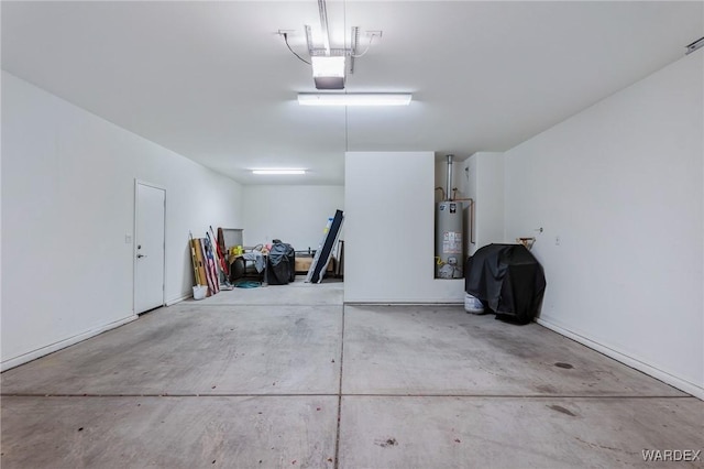 garage with gas water heater and a garage door opener