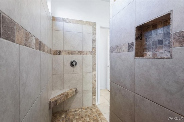 bathroom with tiled shower