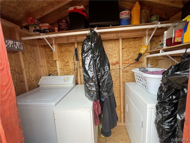 laundry room featuring laundry area and washing machine and clothes dryer