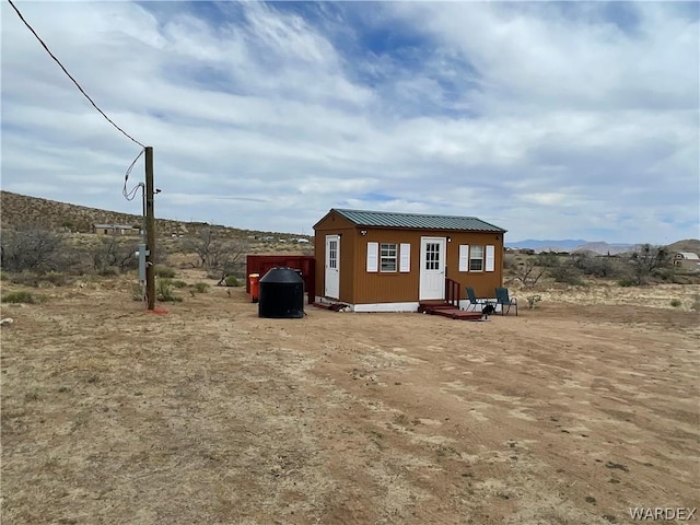 view of outdoor structure featuring a mountain view and an outdoor structure